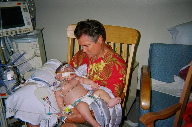 Grandpa Bill holding Keegs before he passed