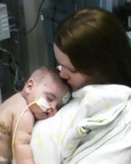 Keegan(6 months) asleep on his mommy. He was finally leaving the Cardiac I.C.U. after 2 and 1/2 months. 